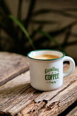 cup of coffee on wooden table