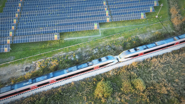 Aerial view of solar panels generating electricity connect to train power lines. Clean, green, renewable energy technologies. Power battery charge Animated graphics eco concept