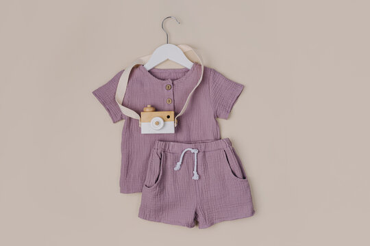 Cotton T-shirt with shorts. Stylish baby clothes and accessories for summer. Fashion kids outfit. Flat lay, top view