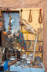Traditional moroccan souvenirs jewels, african masks and hand of Fatima in market in Ait Ben Haddou, Morocco