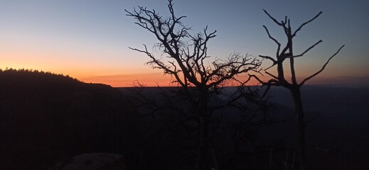 This serene image captures the peaceful transition from day to night at the Grand Canyon, titled...