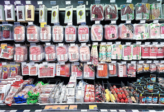 LATVIA, RIGA, 13, NOVEMBER, 2023: Vacuum-packed Ham, Salami And Smoked Meats In The Deli Section Of A SKY And MORE Supermarket. Riga. Latvia.	