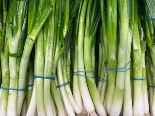 vegetables in the store, young onions on the counter