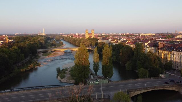 Isar river flowing through the city of Munich in a calm summer morning aerial image
