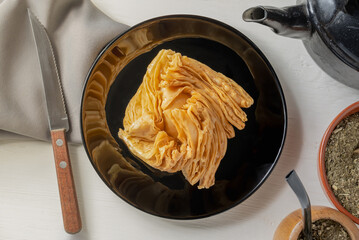 Food of Argentine culture. Fried dessert filled with quince paste or sweet potato paste.