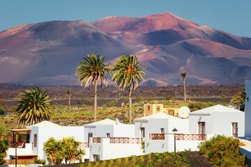 The volcanoes of the Timanfaya National Park seen from the town of Yaiza, Lanzarote, Canary Islands, Spain
