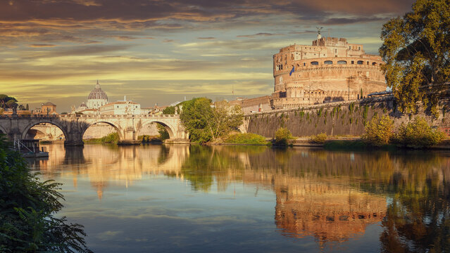 Castel Sant'Angelo and bridge with reflections on the Tiber river in Rome, Italy.