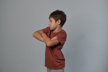 With folded arms and a serious look, he embodies youthful defiance. Suggests the growing...