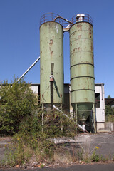 Two raw material silos on an abandoned factory site in Speyer