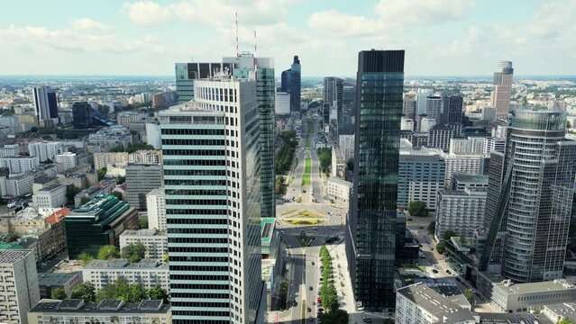 Establishing Aerial Panoramic View of Warsaw City Centre, Poland, Europe. Aerial view of cityscape with modern skyscrapers. : Flying over a busy street in Warsaw city centre 