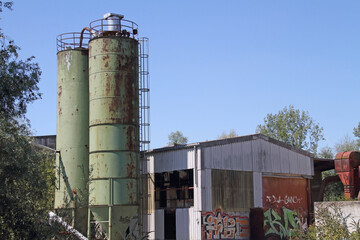Two raw material silos on an abandoned factory site in Speyer