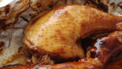 Glazing Oven-Baked Chicken Thigh with Teriyaki Sauce Close-up.