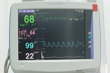 Close up attached medical equipment such as blood pressure cuff, temperature probe and heart rate...