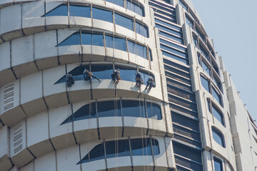 Window cleaning by industrial climbers on the tallest tower.