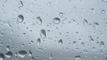 Close-up shot of Raindrops on Glass Surface.
