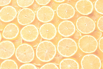 A slices of fresh juicy yellow lemons.  Texture background, pattern.