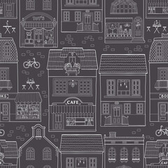 Seamless pattern with European houses. Dutch buildings with shops, bookstores, coffee shops. White outline on a dark background. Monochrome vector sketch illustration in a hand-drawn childish style. - obrazy, fototapety, plakaty