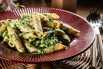 Penne pasta with spinach and chicken.