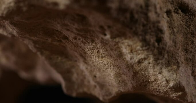 Rock Stone texture close-up. Rought mountain surface. Geological sample. Wall in cave. Macro shot natural mineral background. 