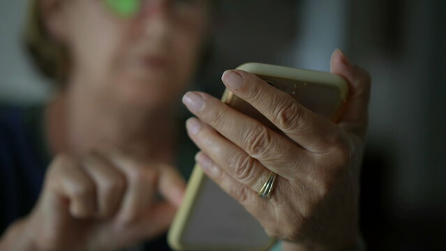 Close-up Senior Woman Hand Holding Phone Messaging With Modern Technology. Older Lady Texting With Smartphone