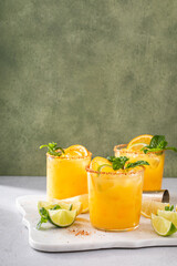 Orange and lime margarita with chili on rim, spicy tropical margarita