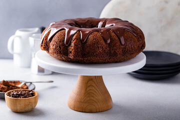 Chocolate bundt cake with chocolate ganache icing - obrazy, fototapety, plakaty