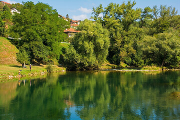 Fototapeta na wymiar The Vrbas River as it flows through Srpske Toplice south east of Banja Luka in Republika Srpska, Bosnia and Herzegovina. Viewed at Vrucica Hot Springs 