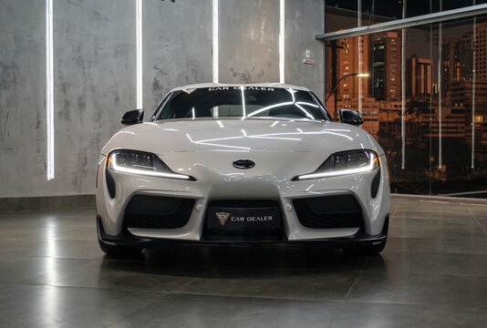 White Toyota Supra Mark V Front View in a modern showroom, night time - High Resolution Image