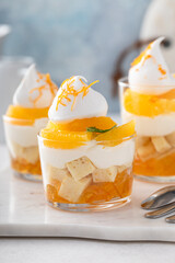 Orange and pound cake layered dessert in glasses, dessert in a cup idea - obrazy, fototapety, plakaty