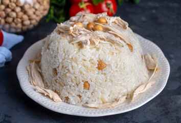 Traditional delicious Turkish food; Rice with chickpeas and chicken (Turkish name; Tavuklu nohutlu pilav or pilaf)