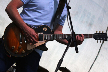 Man playing electric guitar on stage