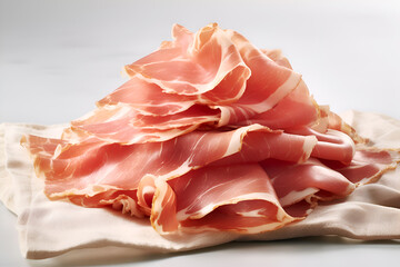 Obraz premium Sliced Prosciutto on Linen Cloth, light background, close-up. Prosciutto ham slices minimalistic image. Traditional italian appetizer, ready to eat. Stack of Prosciutto on Soft Fabric