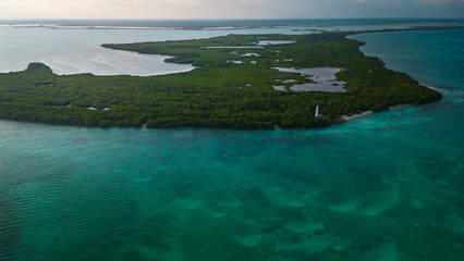 drone fly above natural park biosphere reserve in Tulum Sian Ka'an aerial high angle of punta Allen lighthouse