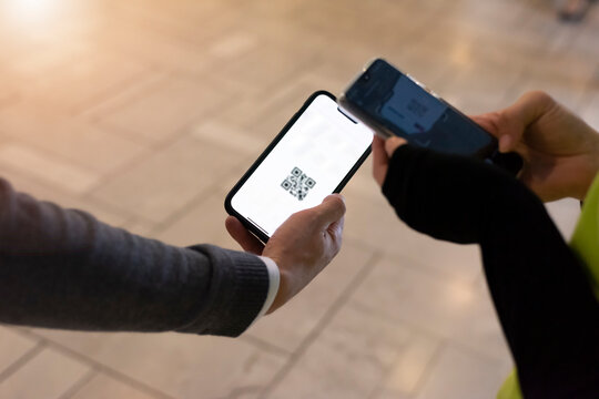 Event QR code ticket scanning. Businessman registering for a business conference using his smart phone