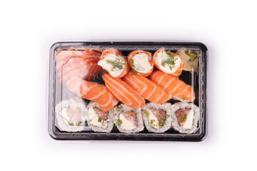 Japanese oriental food tray sushi closed with transparent lid delivery isolated on background top view white background