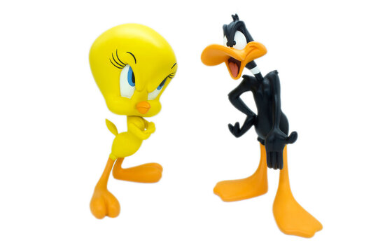 Studio image of Tweety and Daffy Duck on a white isolated background.