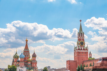 Intercession Cathedral or St. Basil's Cathedral and the Spassky Tower of Moscow Kremlin at Red Square in Moscow, Russia - obrazy, fototapety, plakaty