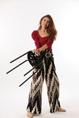 model woman with pants and red shirt on white background