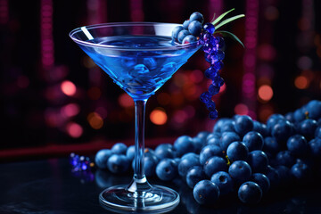 Glass of liqueur with blue grapes