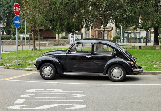 Ronchi dei Legionari, Italy. November 14, 2023. Vintage black Volkswagen Beetle, or Type 1 in a city street. Side view.