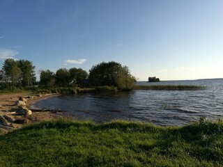 recreation center in the summer. Sapboard, river and reeds, sunset or sunrise.