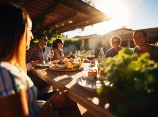 Poster Italian friends eating appetizers, drinking red and white wine in outdoor restaurant table. Happy family having barbeque dinner party in home garden. Concept of winery, dining, lifestyle and beverage. © burntime555