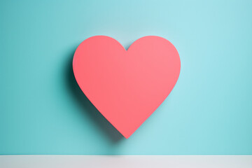 Minimal composition of pastel pink heart on pastel blue wall. Inspired by love, Valentine's Day.