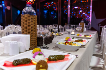 Turkish dishes; stuffed leaves (yaprak sarma dolma) and sauces