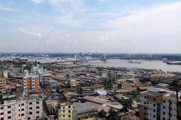 Obraz premium A beautiful sunny view of chittagong city. Karnafuli river side. Top view of chittagong city,Bangladesh.