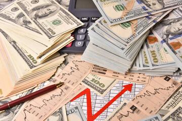 Paper money dollar banknotes, graph and calculator