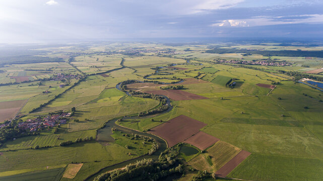 Lush farmlands by Meuse, seen from the sky.