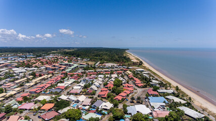 Kourou's colorful homes near Atlantic coast.