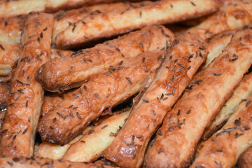Homemade salty crackers sticks with cheese and cumin, cheese sticks