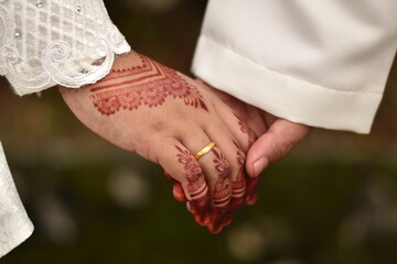 bride and groom holding hands